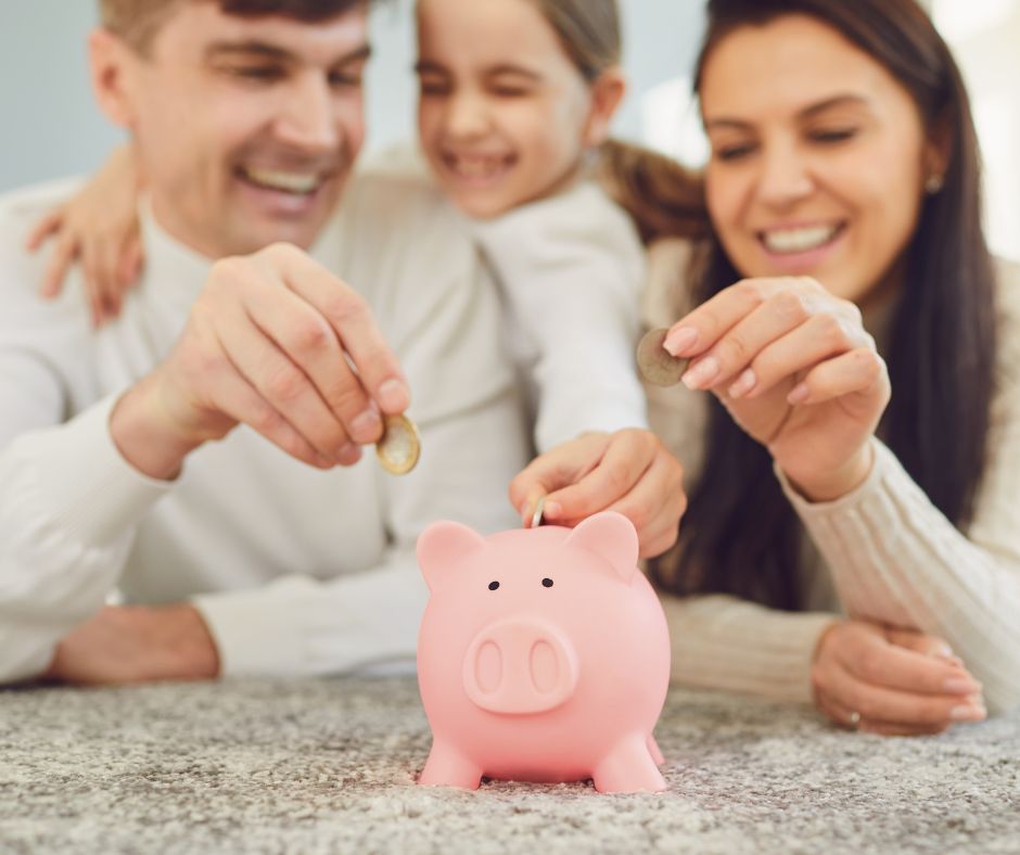 family putting money in bank