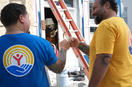 Volunteers giving fistbump