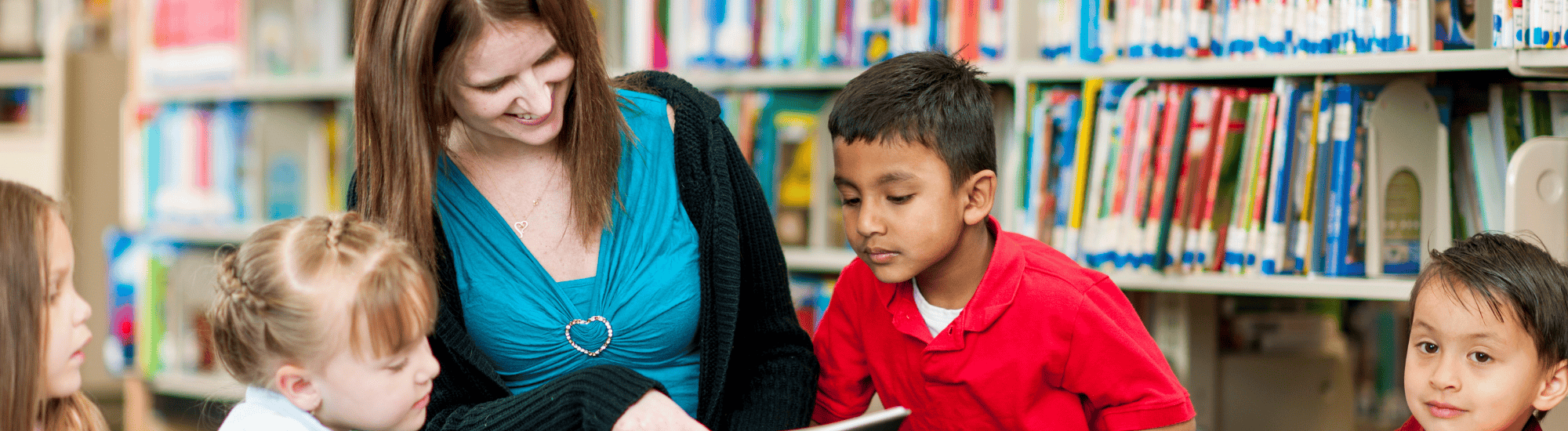 Volunteer reading to classroom